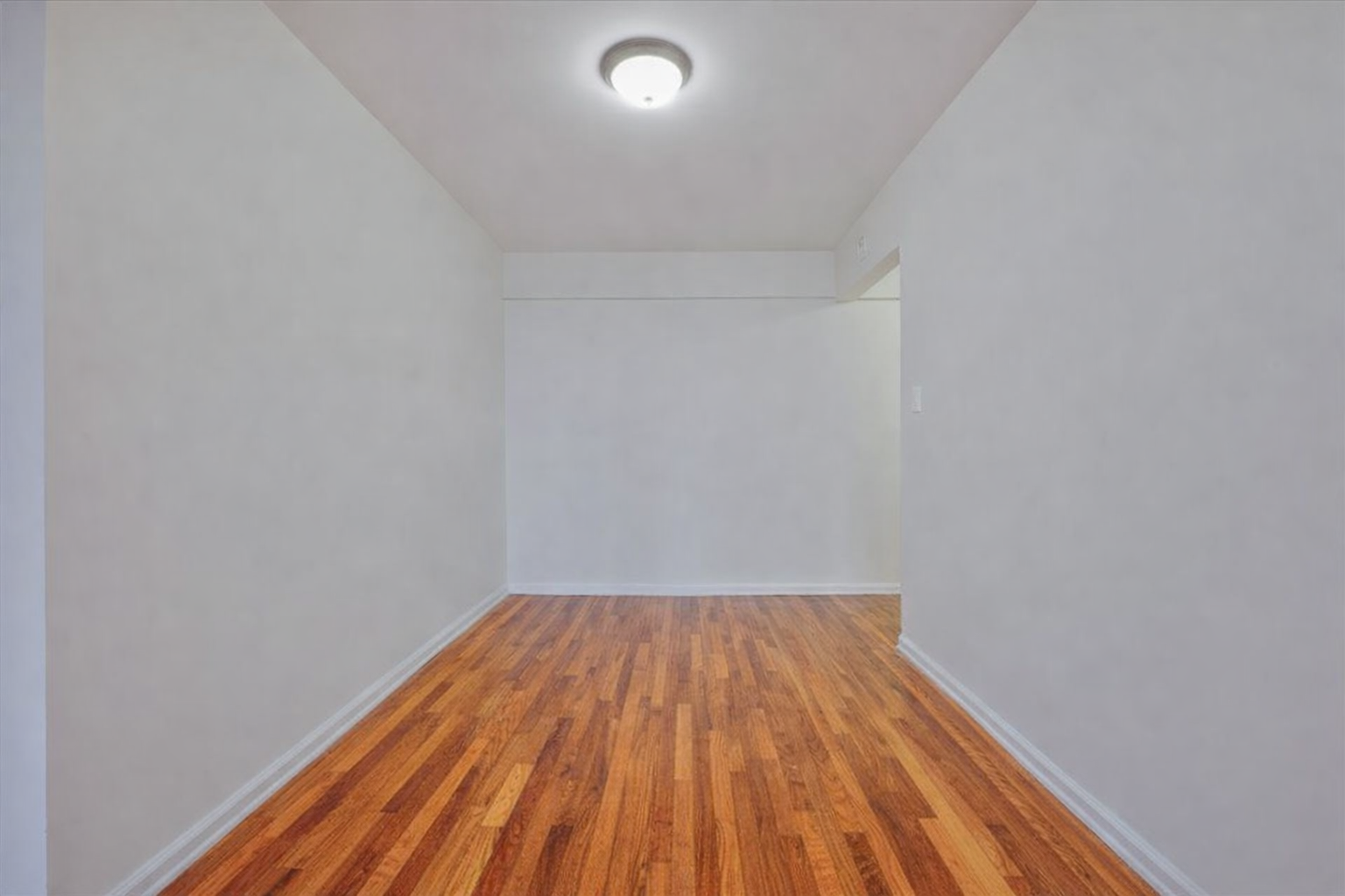 1270 East 51st Street, Unit 6X Brooklyn, NY 11234 - Photo 15 of 17 a view of wooden floor in a room