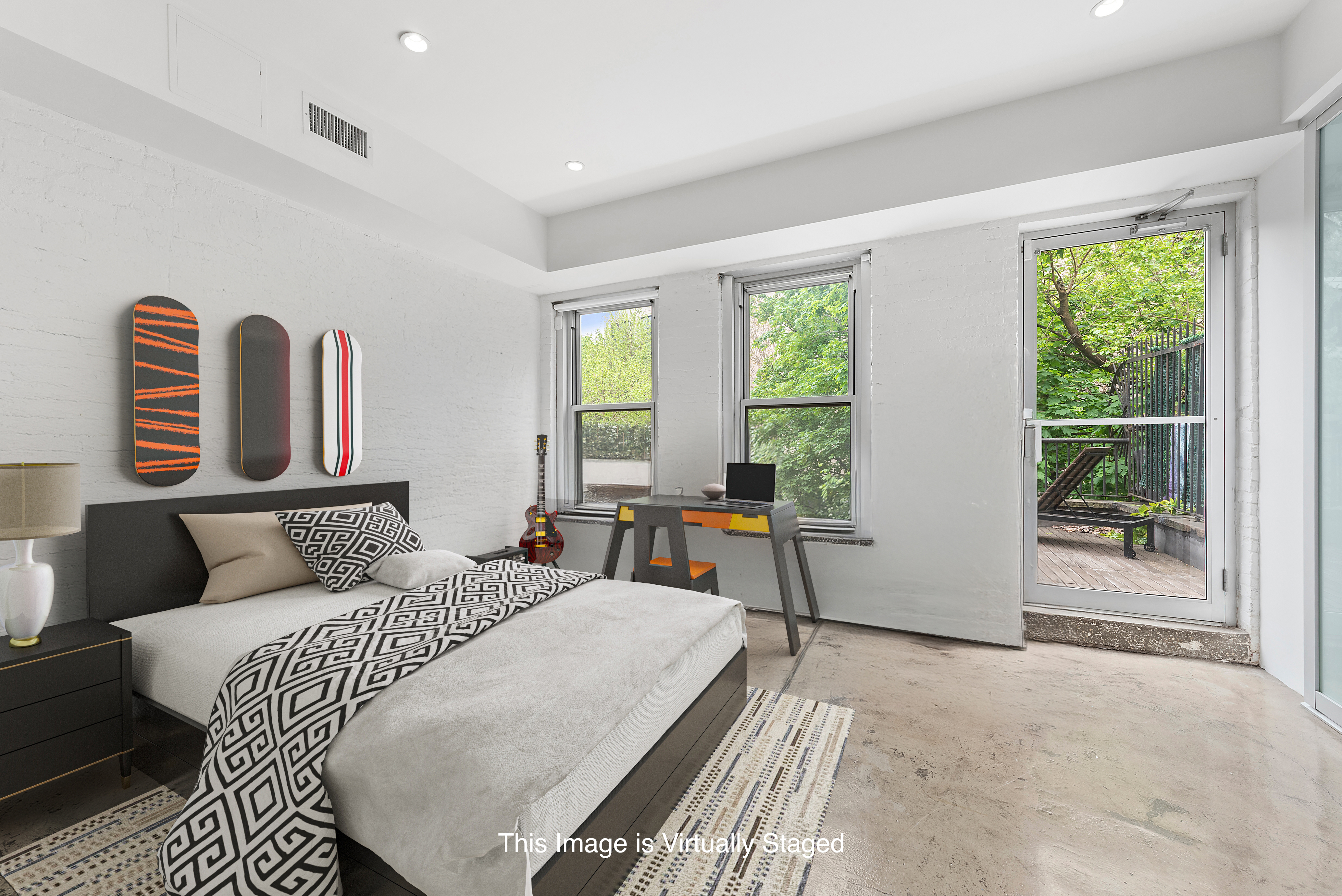 22 West 120th Street Manhattan, NY 10027 - Photo 12 of 21 a bedroom with a bed and wooden floor