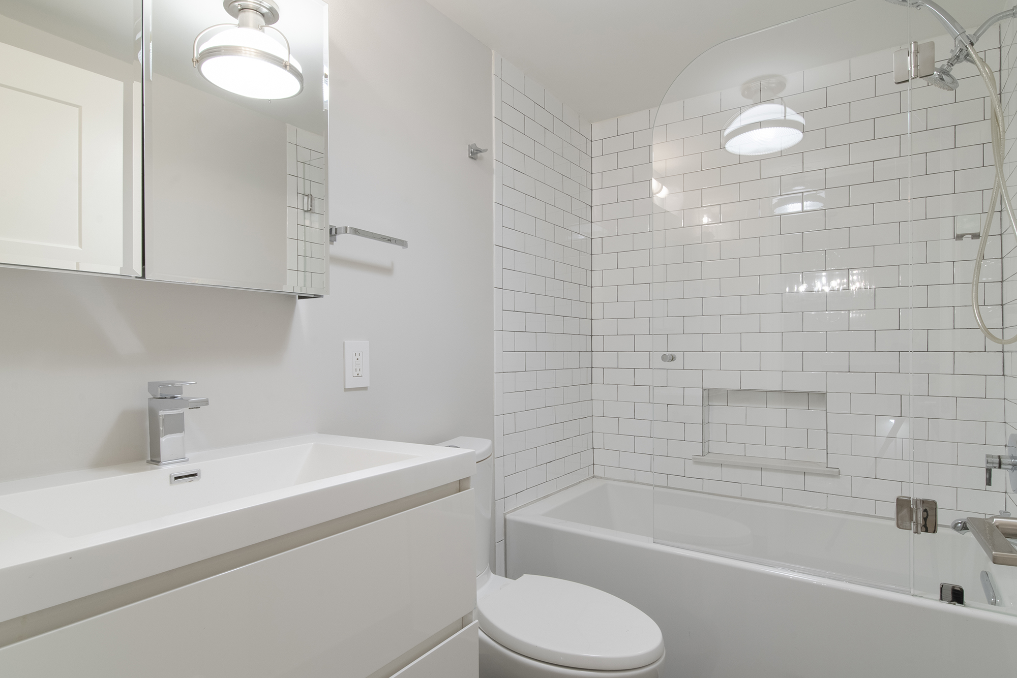 407 East 12th Street, Unit 1RSE Manhattan, NY 10009 - Photo 11 of 13 a bathroom with a sink toilet and shower