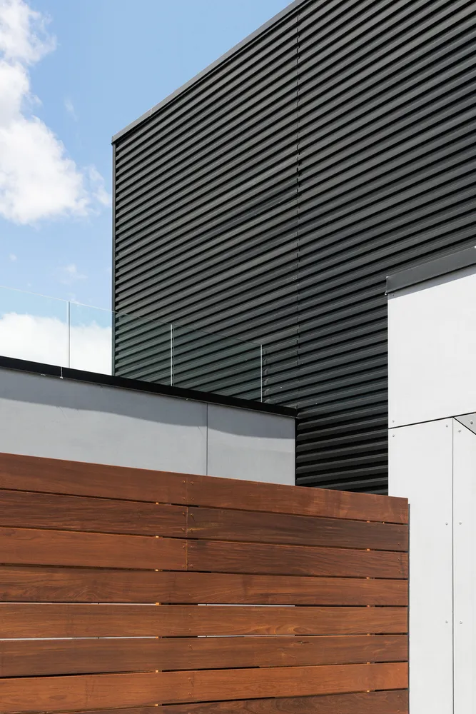 a picture of a bench in front of a wall