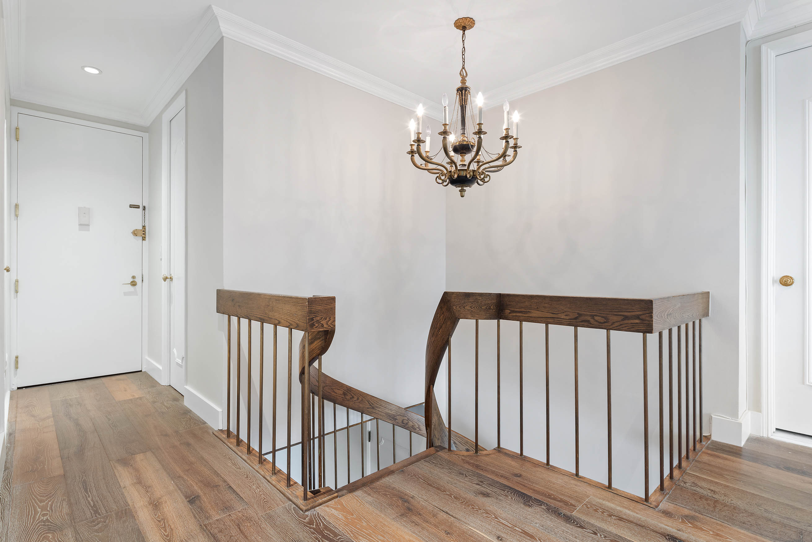 530 East 76th Street, Unit PH36/37E Manhattan, NY 10021 - Photo 11 of 29 a view of a hallway with wooden floor