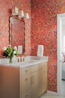 a room with a sink and a mirror