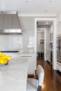 a living room with fireplace furniture and a table
