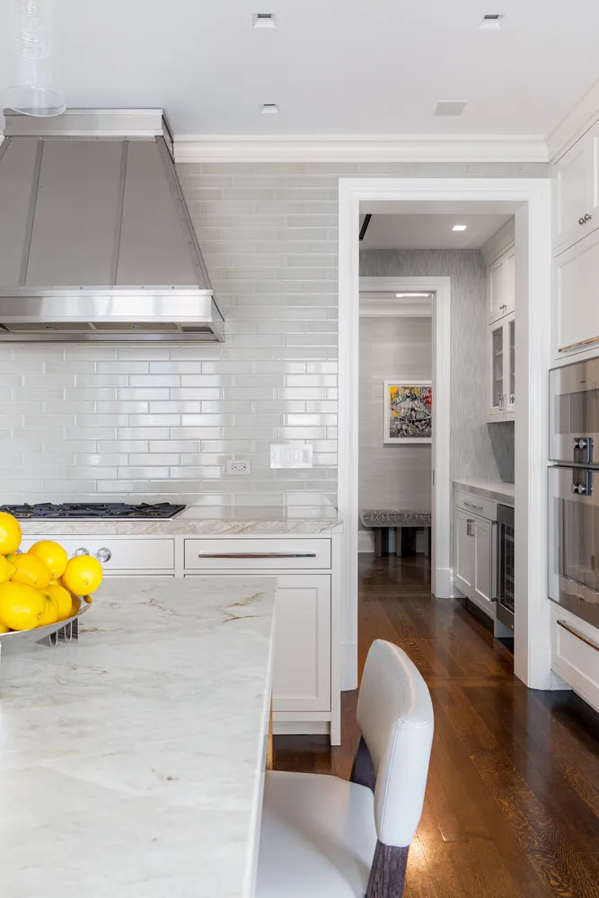 a living room with fireplace furniture and a table