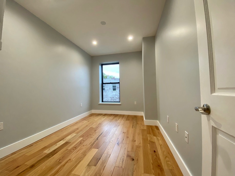 465 6th Avenue, Unit 2 Brooklyn, NY 11215 - Photo 5 of 10 a view of a room with wooden floor and window