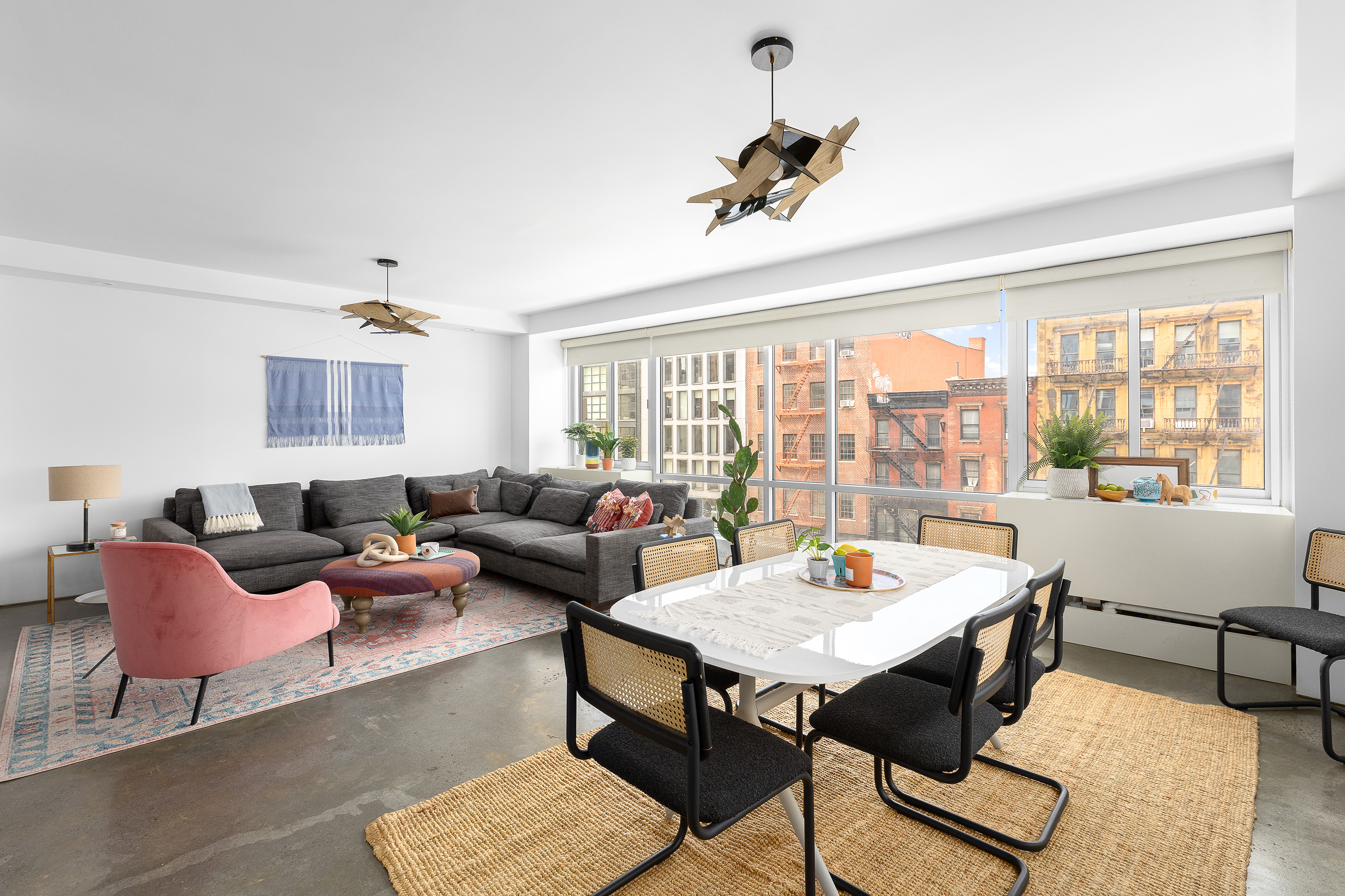 263 Bowery, Unit 5 Manhattan, NY 10002 - Photo 11 of 12 a living room with furniture and a large window