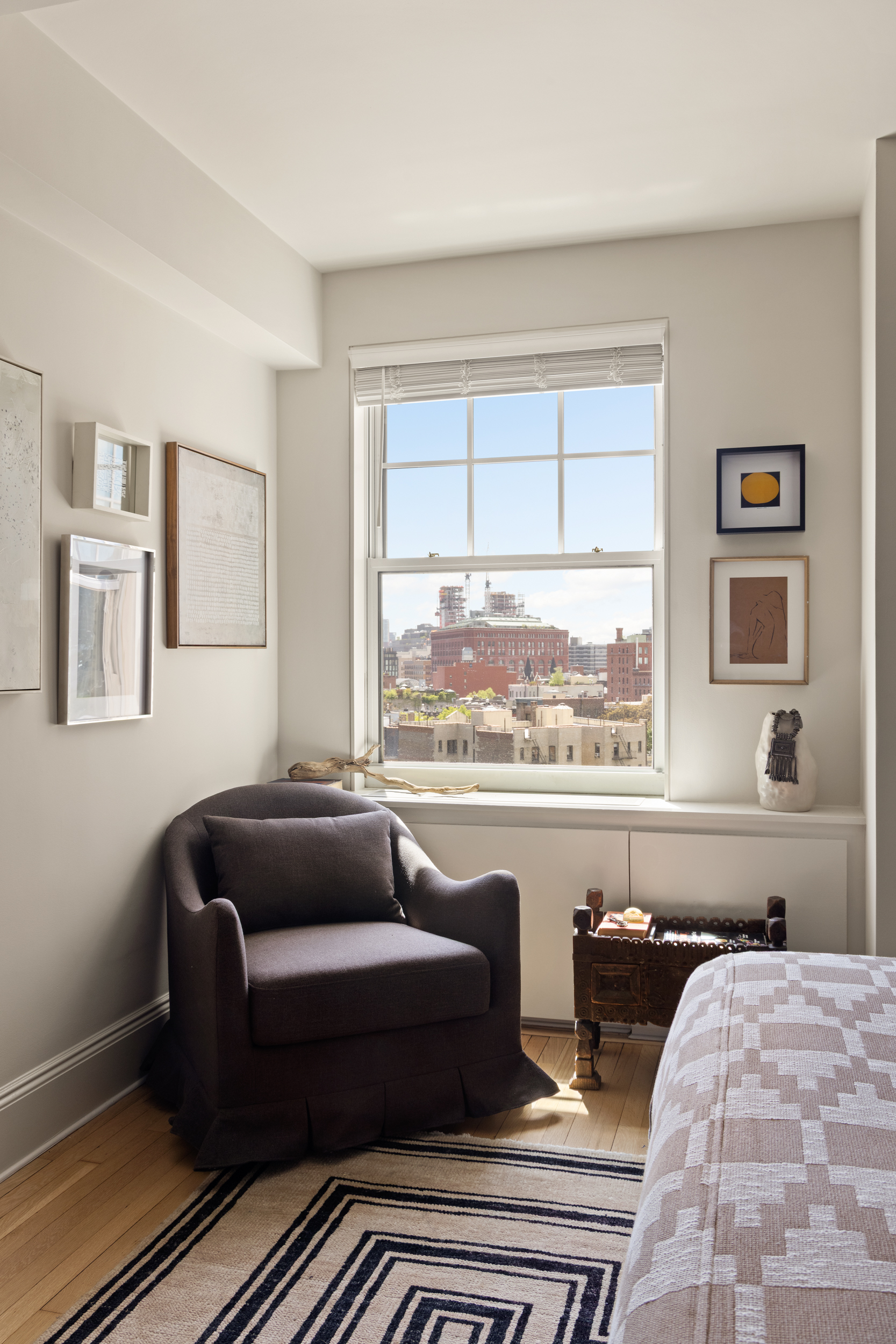 302 West 12th Street, Unit 11F Manhattan, NY 10014 - Photo 11 of 17 a living room with furniture and a large window
