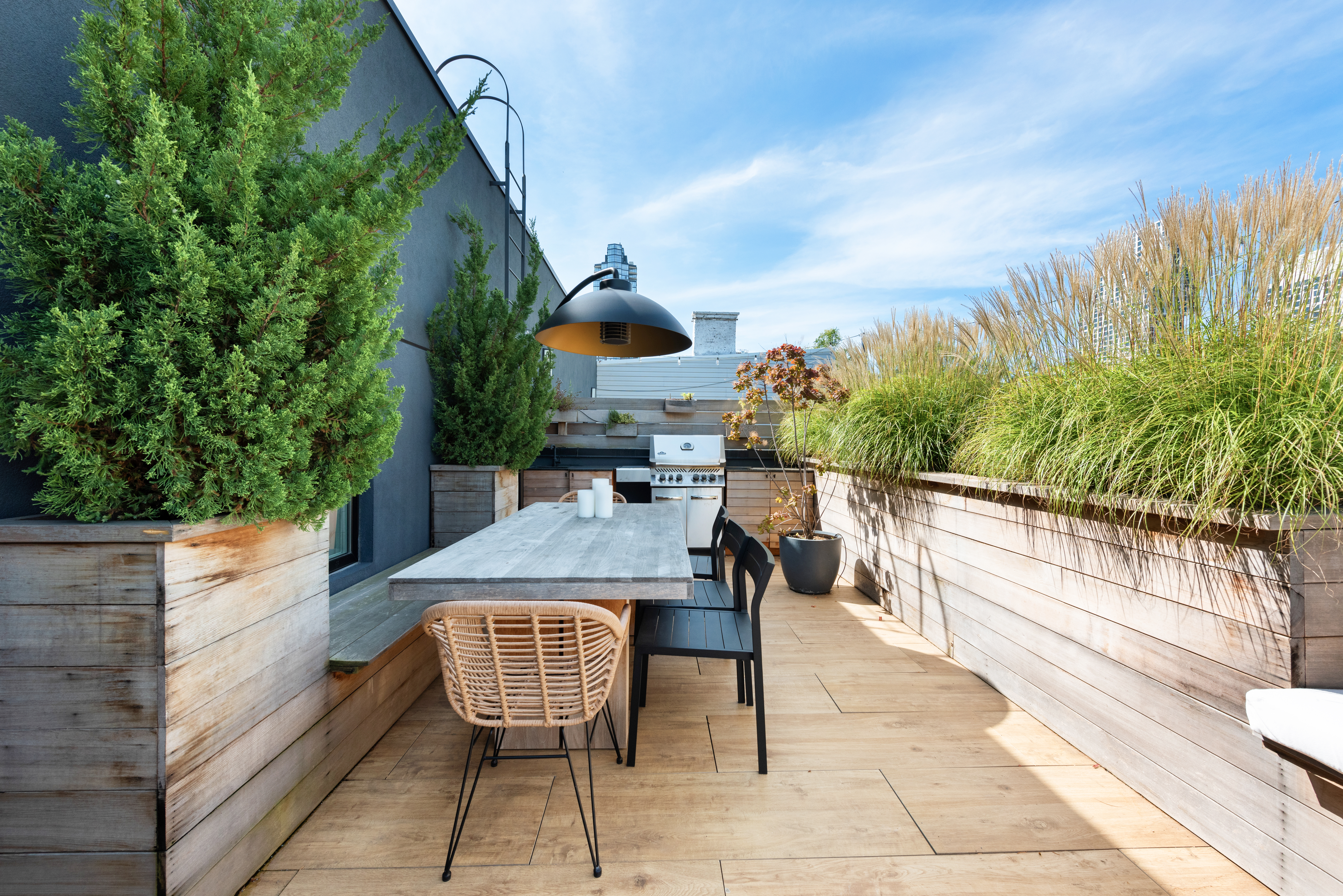 102 Huron Street, Unit 3B Brooklyn, NY 11222 - Photo 4 of 18 a view of a patio with couches table and chairs and potted plants