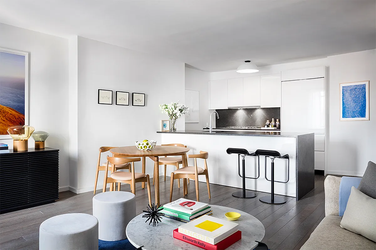 385 1st Avenue, Unit 11A Manhattan, NY 10010 - Photo 2 of 11 a living room with furniture and a flat screen tv