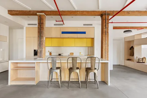 a view of dining table chairs and chandelier