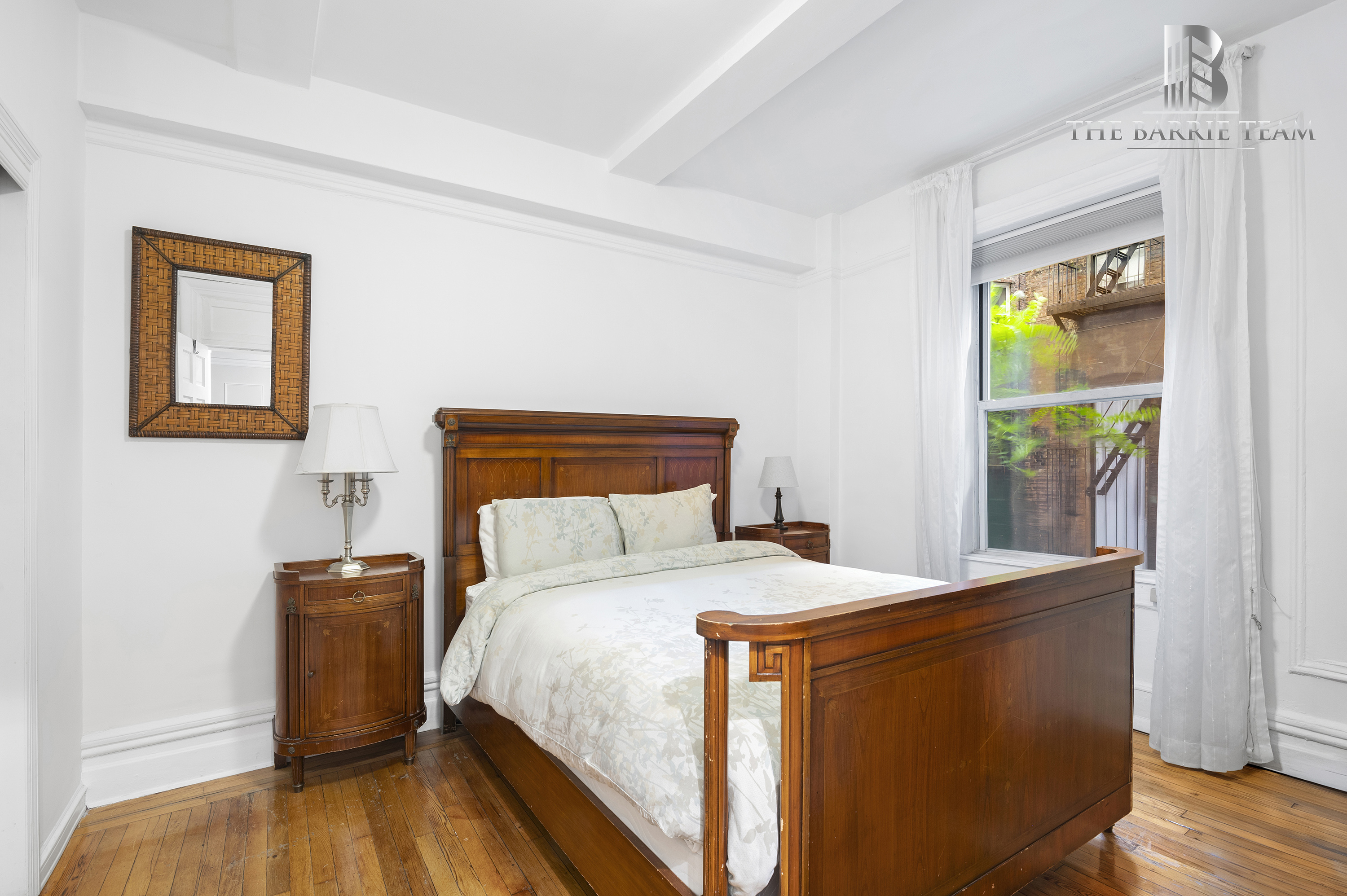 203 West 81st Street, Unit 3E Manhattan, NY 10024 - Photo 2 of 6 a bedroom with a bed and a table