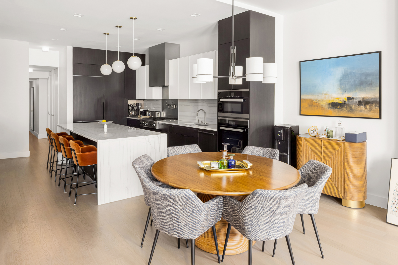 74 Grand Street, Unit 5 Manhattan, NY 10013 - Photo 7 of 12 a kitchen with a dining table and chairs