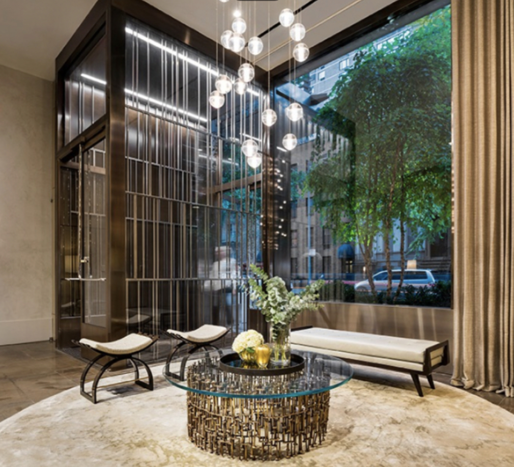 301 East 50th Street, Unit 17B Manhattan, NY 10022 - Photo 10 of 12 a roof deck with couches and a potted plant