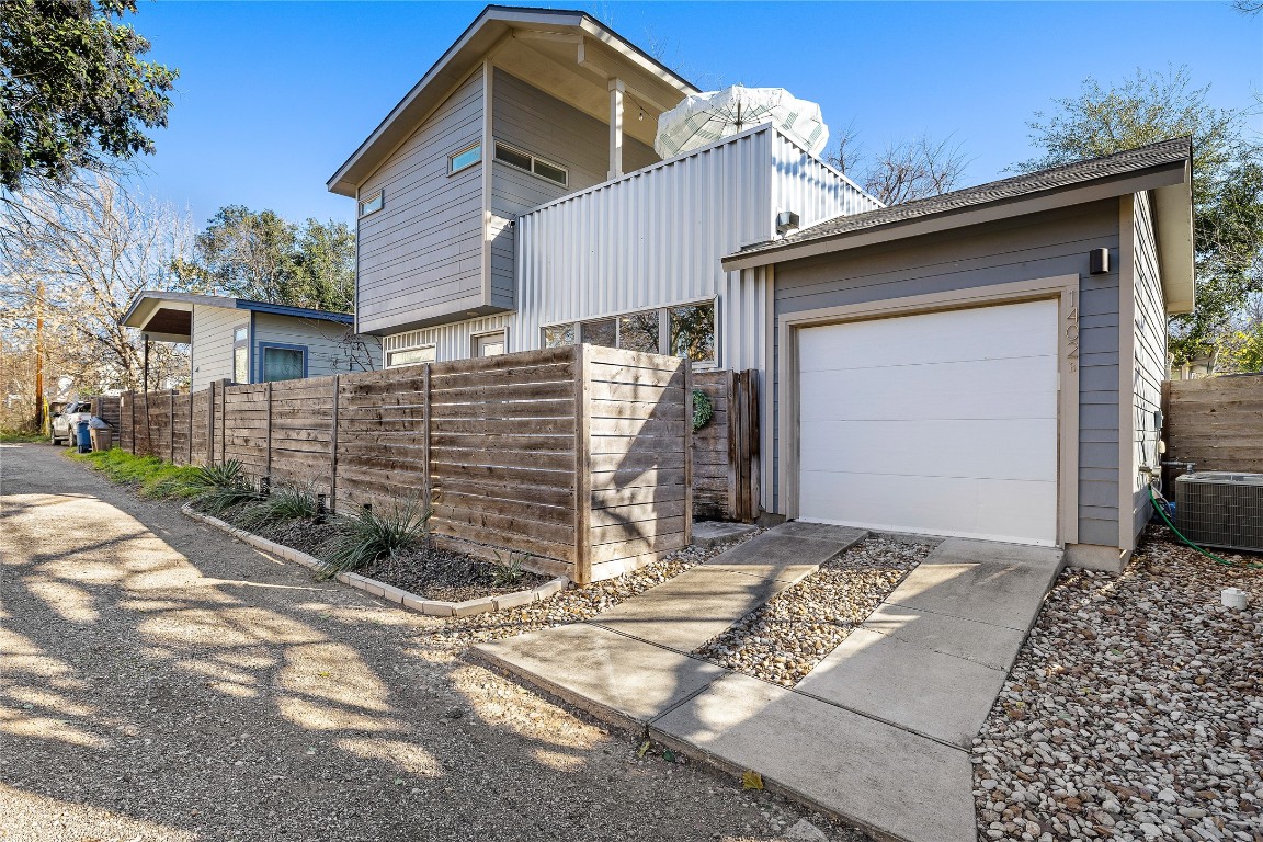 1402 Singleton Avenue, Unit B Austin, TX 78702 - Photo 26 of 26 a front view of a house with a yard