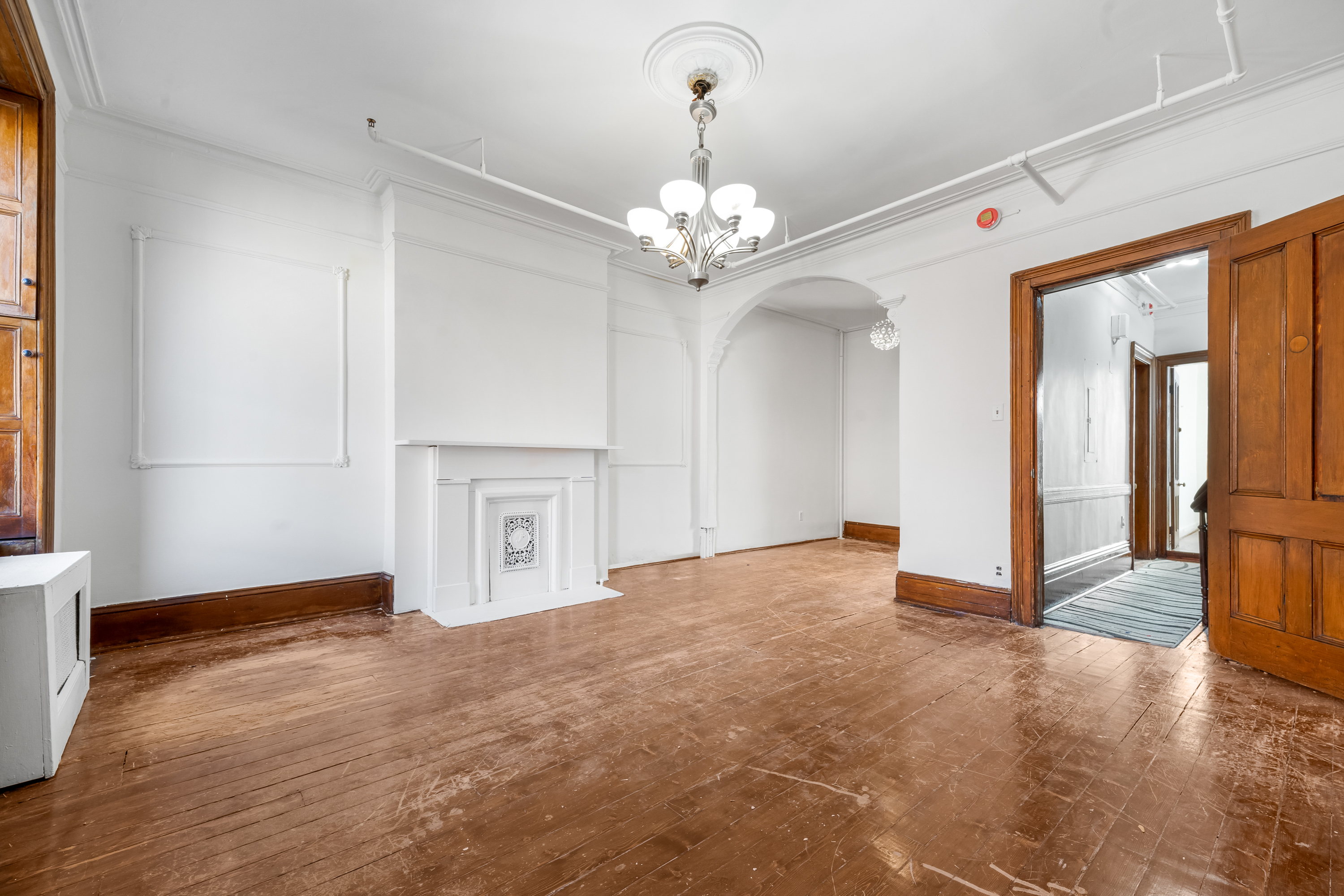 458 West 153rd Street Manhattan, NY 10031 - Photo 13 of 21 a view of a livingroom with a chandelier