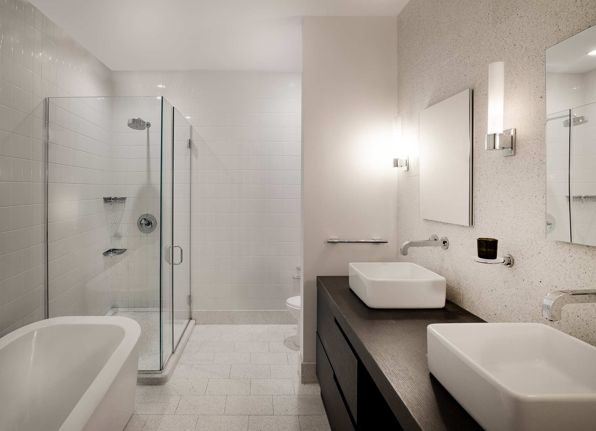 360 Furman Street, Unit 701 Brooklyn, NY 11201 - Photo 9 of 14 a spacious bathroom with a double vanity sink a mirror and a bathtub