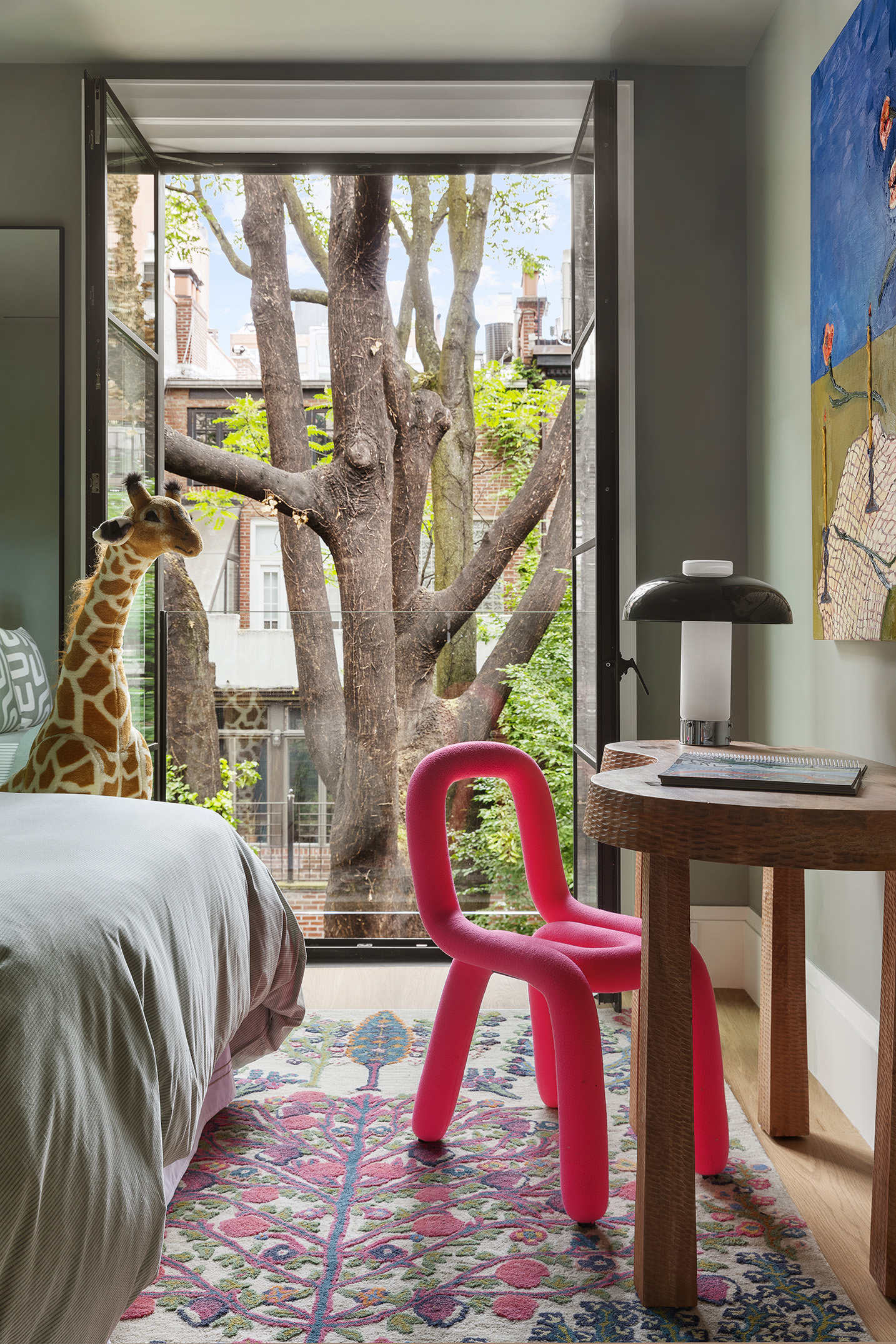 17 East 9th Street Manhattan, NY 10003 - Photo 19 of 32 a bedroom with a bed and a window