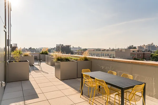 310 Clarkson Avenue, Unit 511 Brooklyn, NY 11226 - Photo 9 of 12 a view of a terrace with furniture and city view