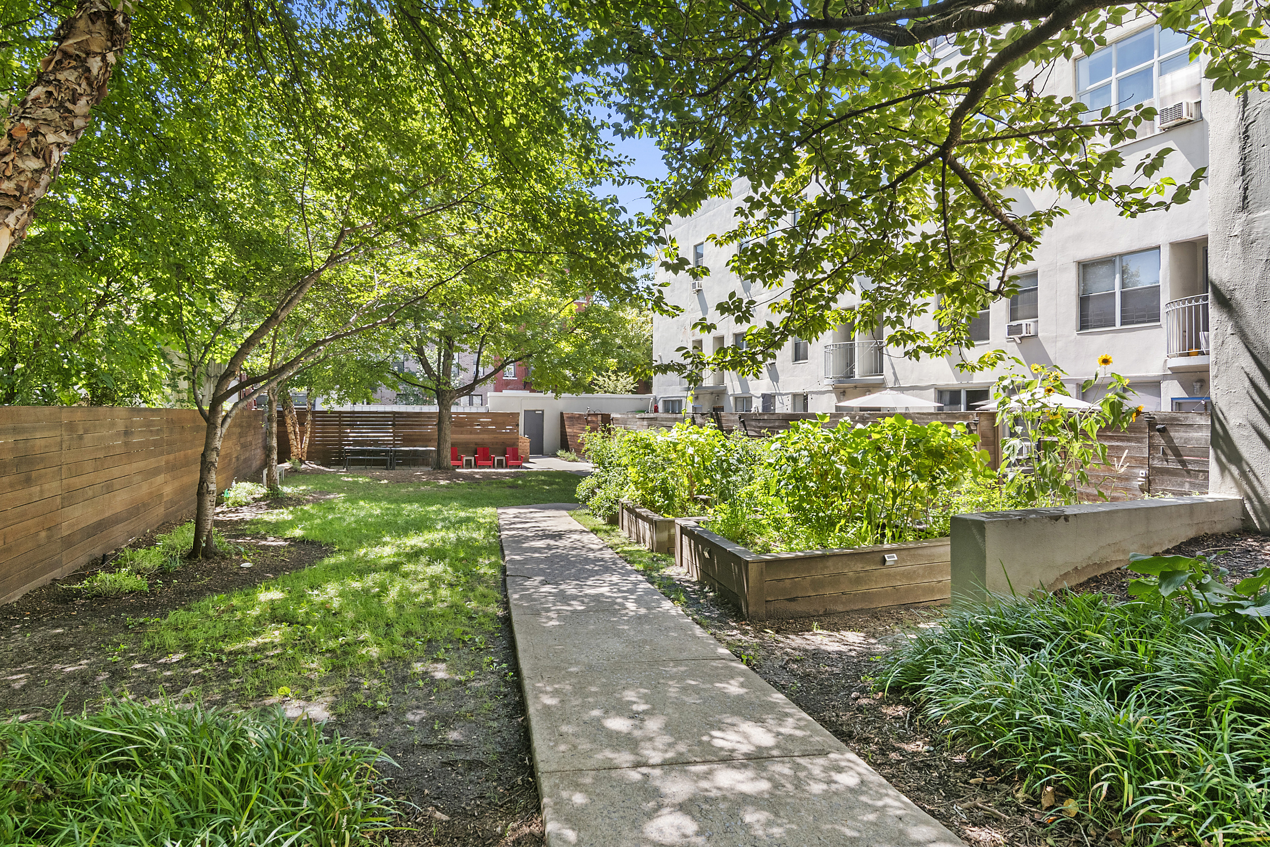 204 Huntington Street, Unit 3E Brooklyn, NY 11231 - Photo 11 of 13 a front view of a house with a yard