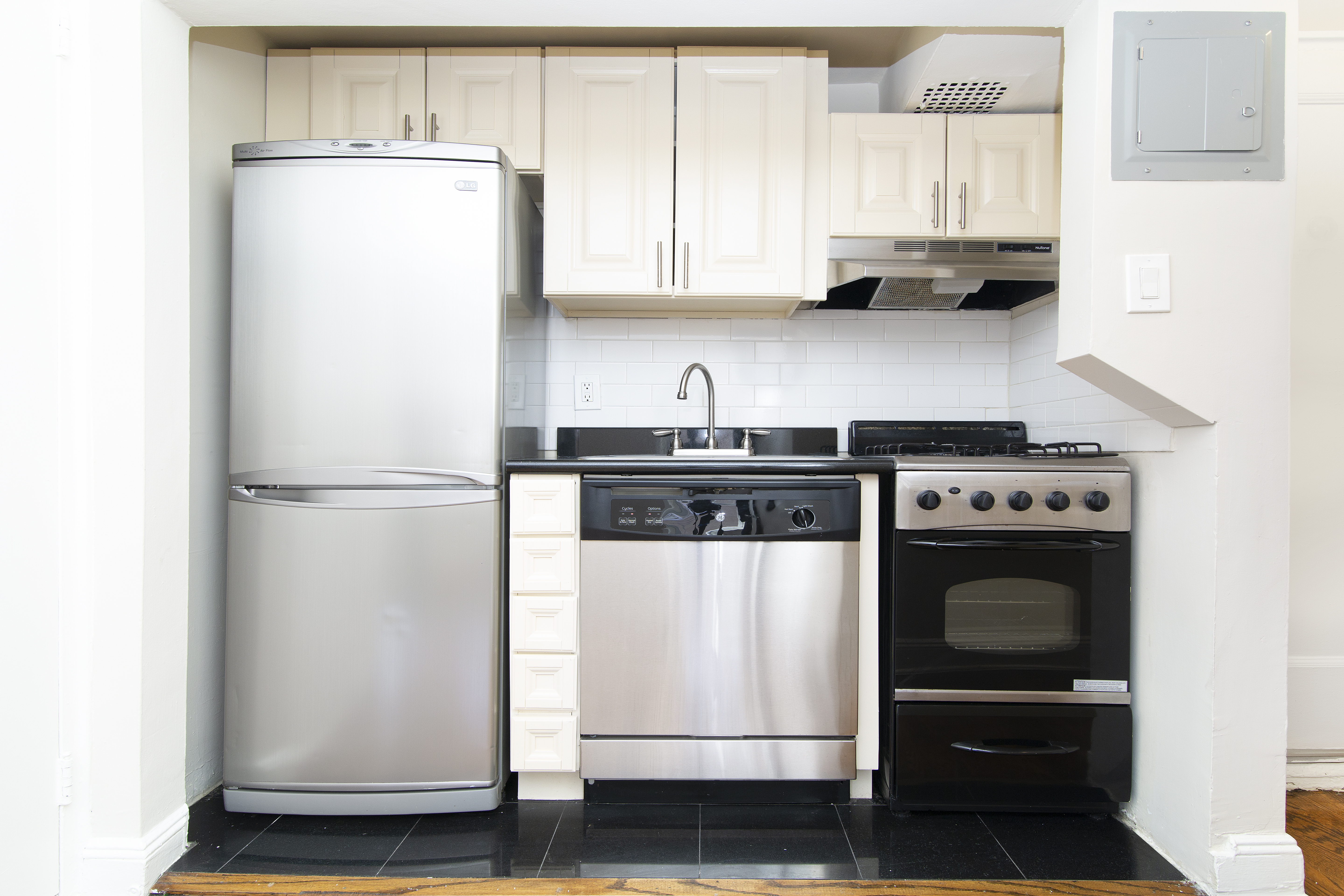304 Bleecker Street, Unit 3F Manhattan, NY 10014 - Photo 2 of 6 a kitchen with a refrigerator and a stove