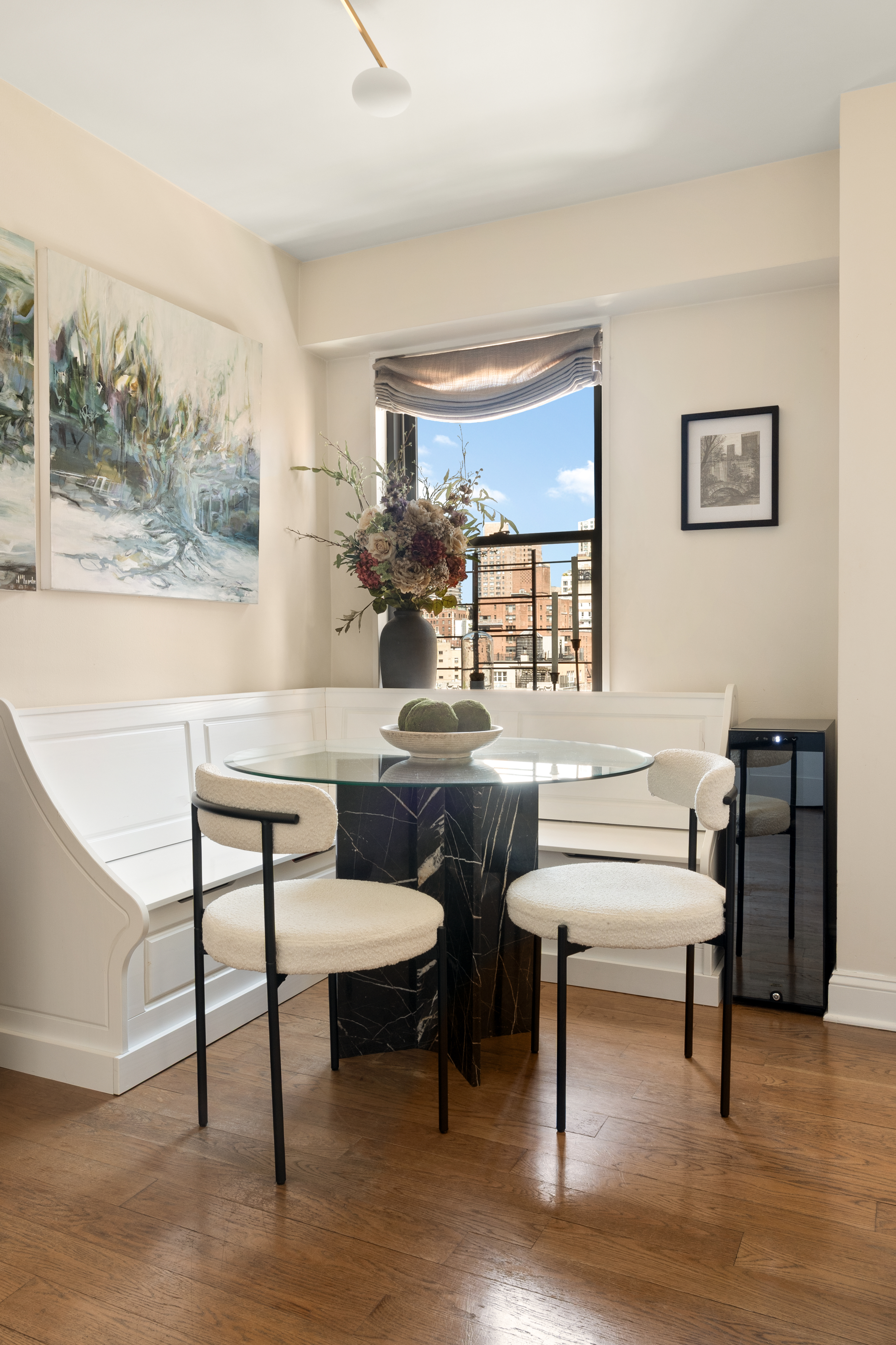 178 East 80th Street, Unit 15C Manhattan, NY 10075 - Photo 4 of 12 a living room with furniture a rug and a large window