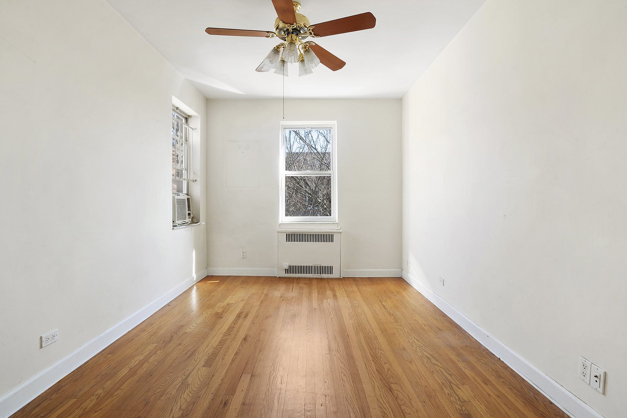 1615 Avenue I, Unit 603 Brooklyn, NY 11230 - Photo 9 of 13 a view of empty room with wooden floor and fan