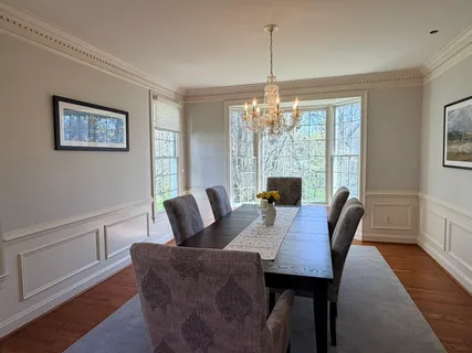 a view of a dining room with furniture window and outside view