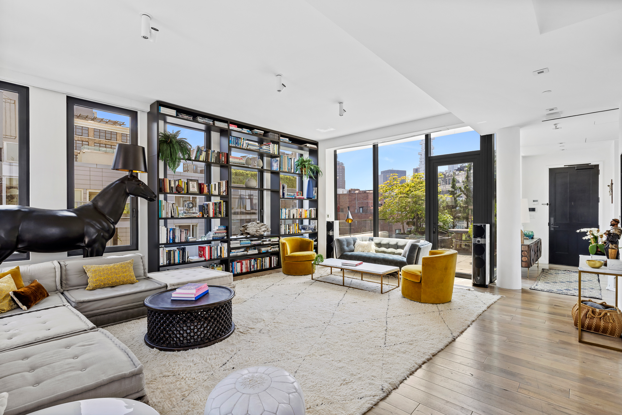 15 Renwick Street, Unit PH2 Manhattan, NY 10013 - Photo 2 of 23 a living room with furniture and floor to ceiling window