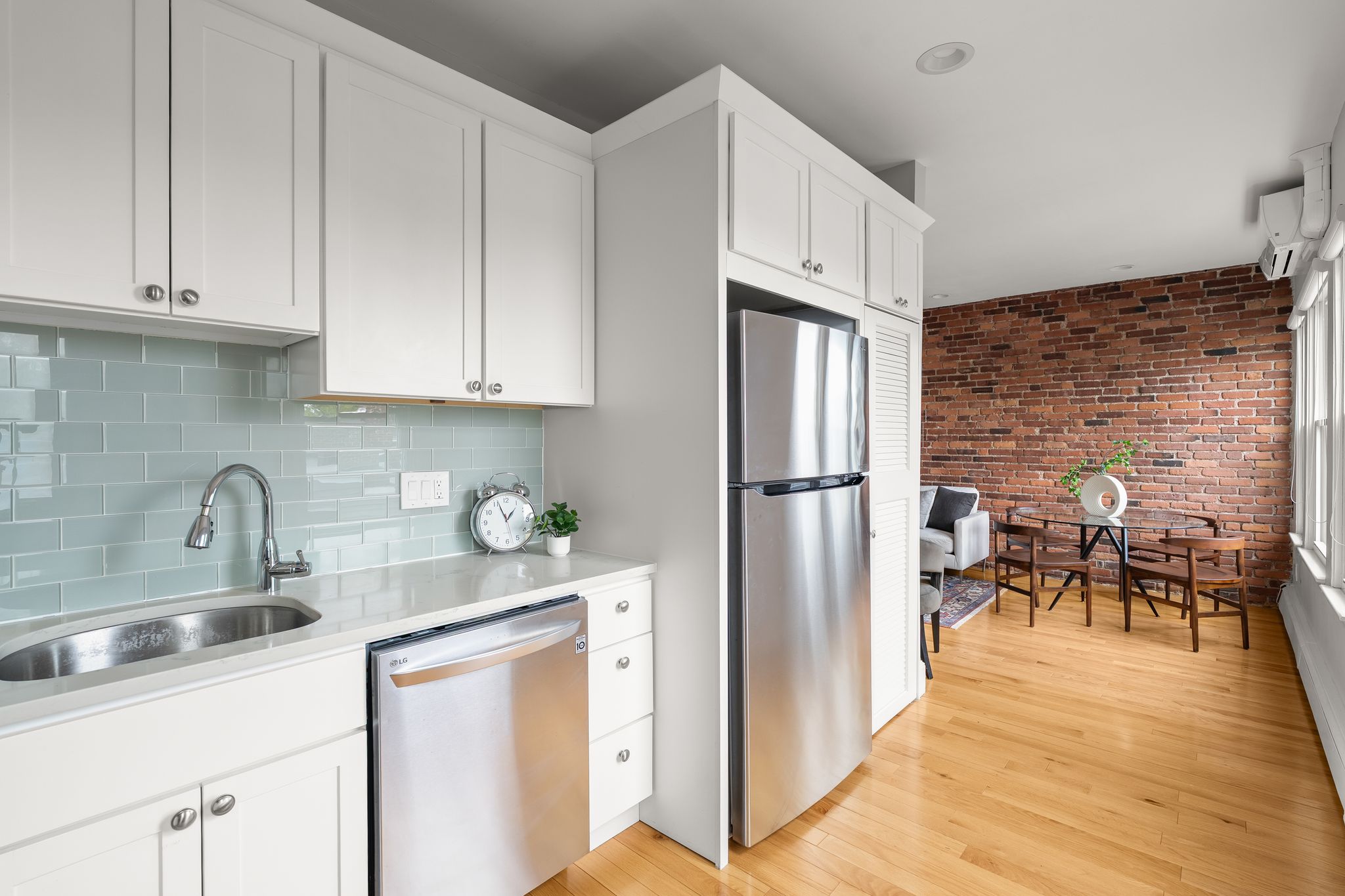 88 Hancock Street, Unit 17 Cambridge, MA 02139 - Photo 6 of 18 a kitchen with stainless steel appliances granite countertop a refrigerator sink and cabinets