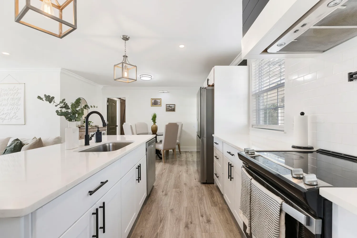 a view of a dining room with furniture and wooden floor