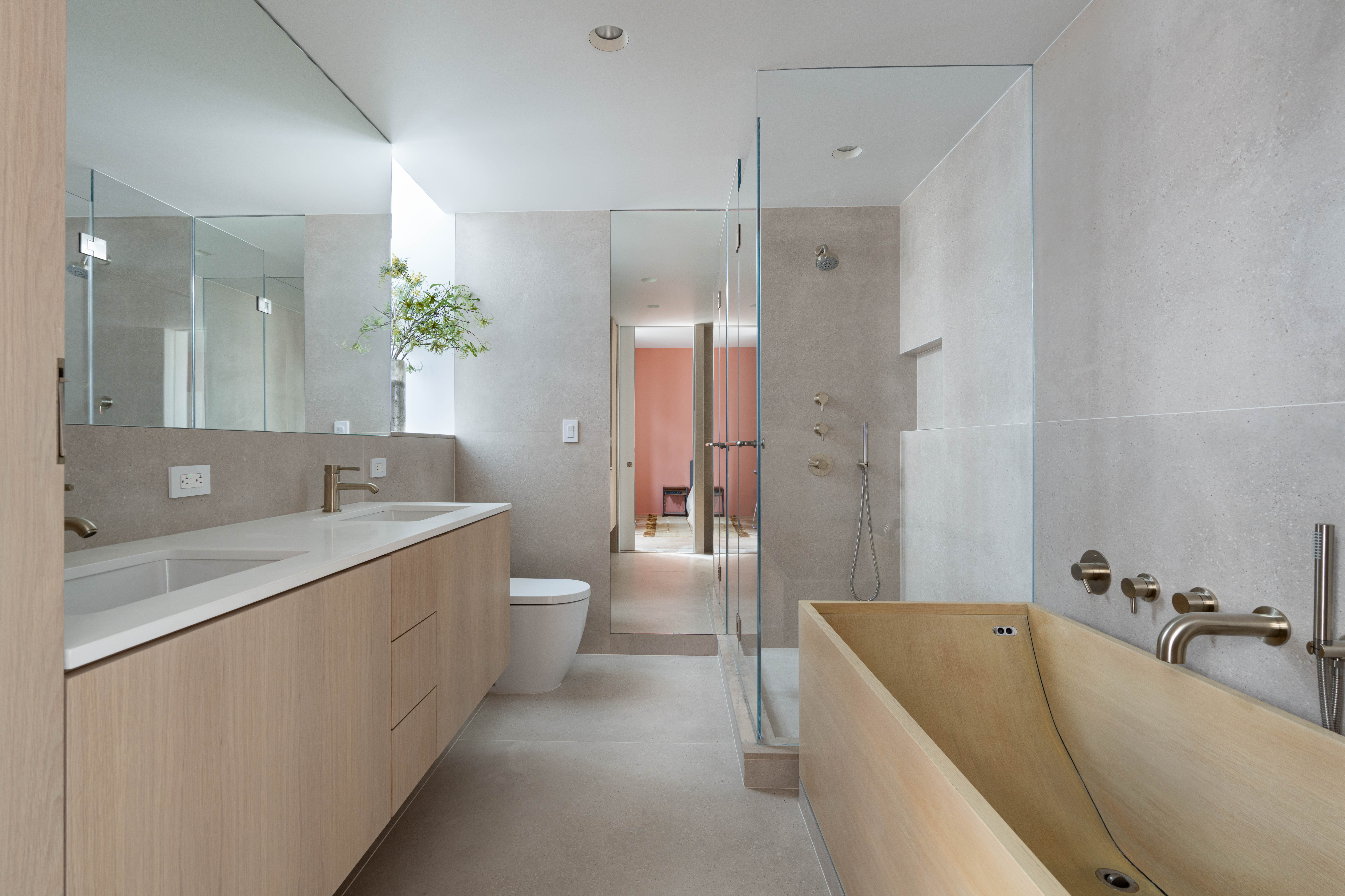 125 West 22nd Street, Unit 10A Manhattan, NY 10011 - Photo 8 of 11 a bathroom with a granite countertop tub sink and mirror