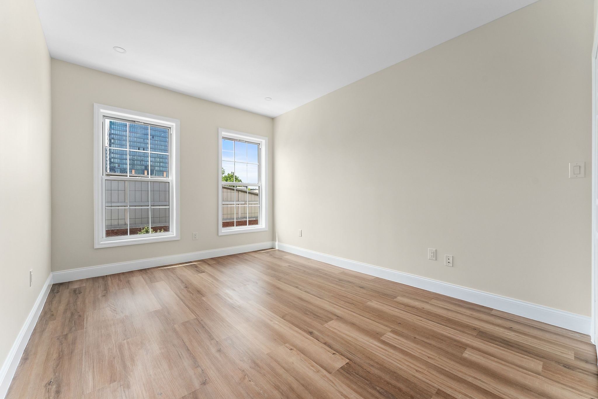 217 Butler Street, Unit 2 Brooklyn, NY 11217 - Photo 10 of 15 a view of an empty room with wooden floor and a window