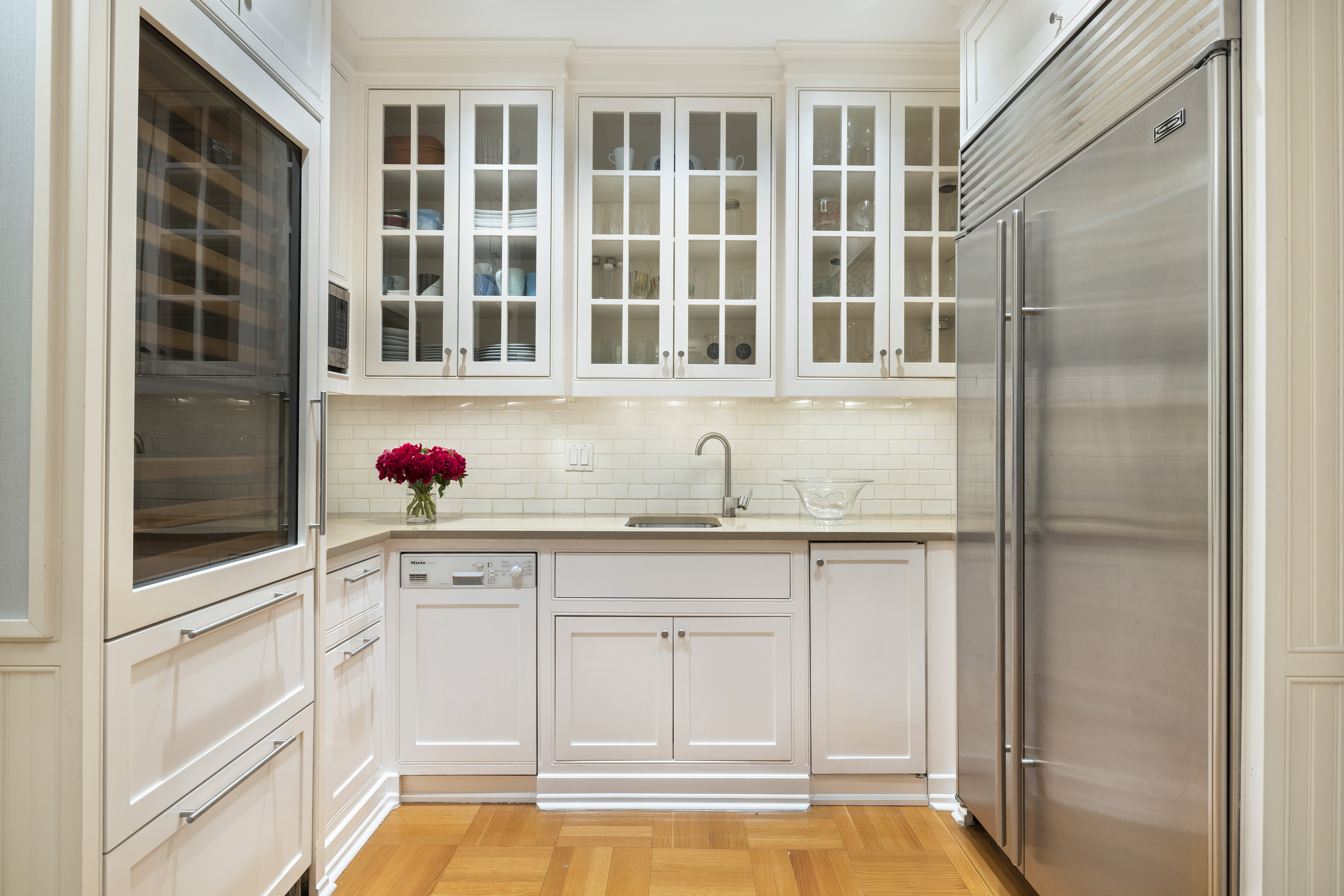 325 West End Avenue, Unit 6AB Manhattan, NY 10023 - Photo 9 of 22 a bathroom with granite countertop a sink and a shower