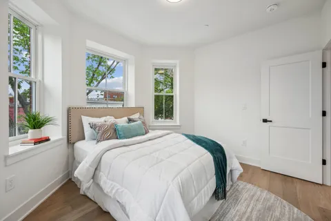 a bedroom with a bed and a table
