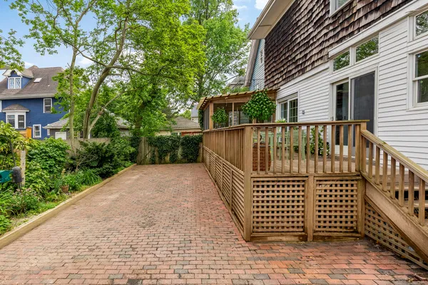 a view of a balcony with wooden floor