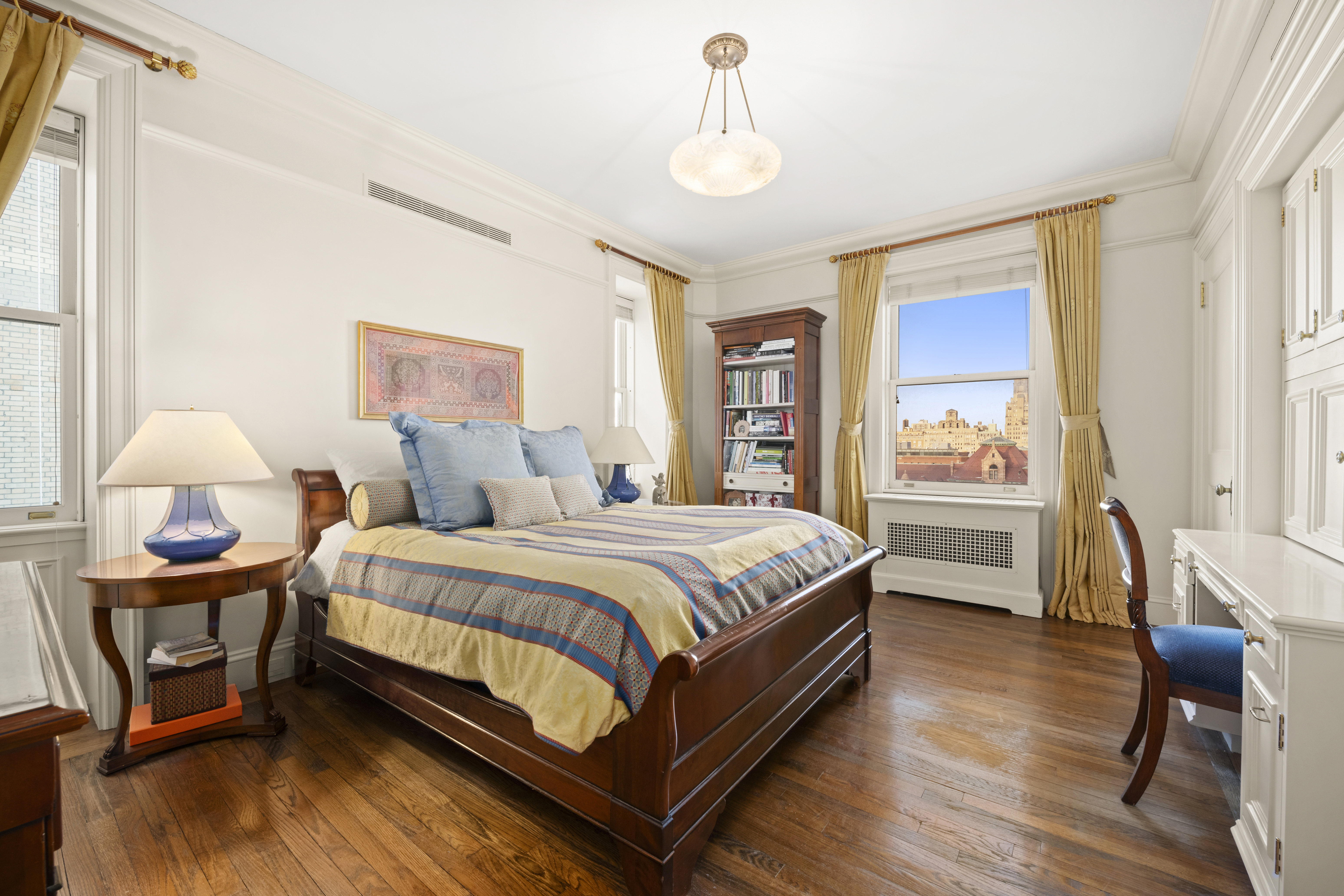 151 Central Park West, Unit 11NORTH Manhattan, NY 10023 - Photo 16 of 19 a spacious bedroom with a bed and wooden floor