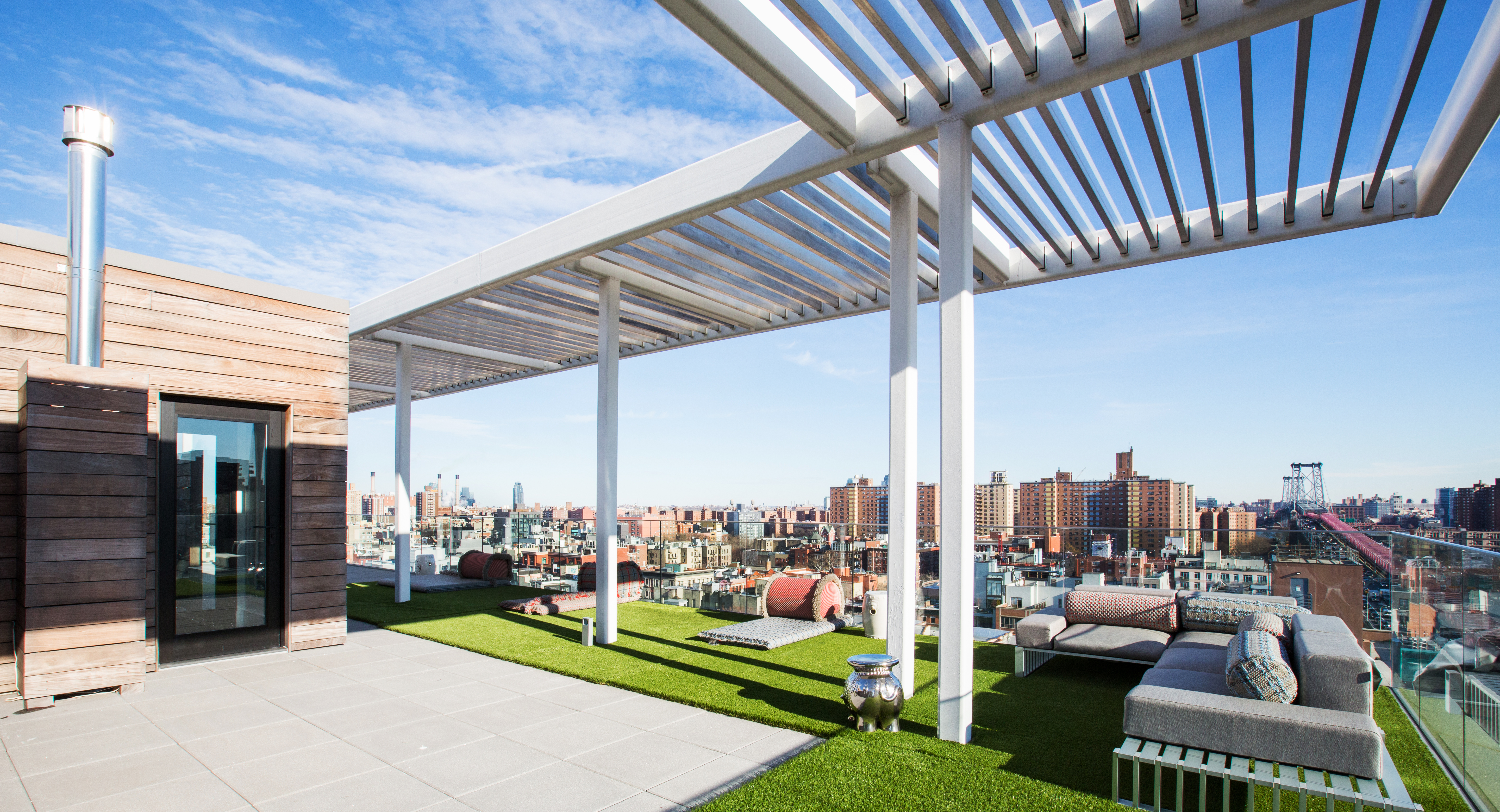 100 Norfolk Street, Unit PH Manhattan, NY 10002 - Photo 21 of 23 a view of a terrace with couches and a table