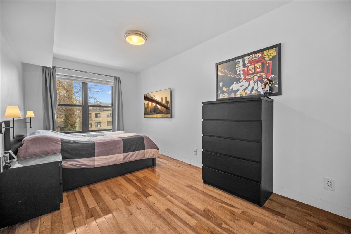 1477 Prospect Place, Unit 2 Brooklyn, NY 11213 - Photo 8 of 14 a bedroom with a bed and a window