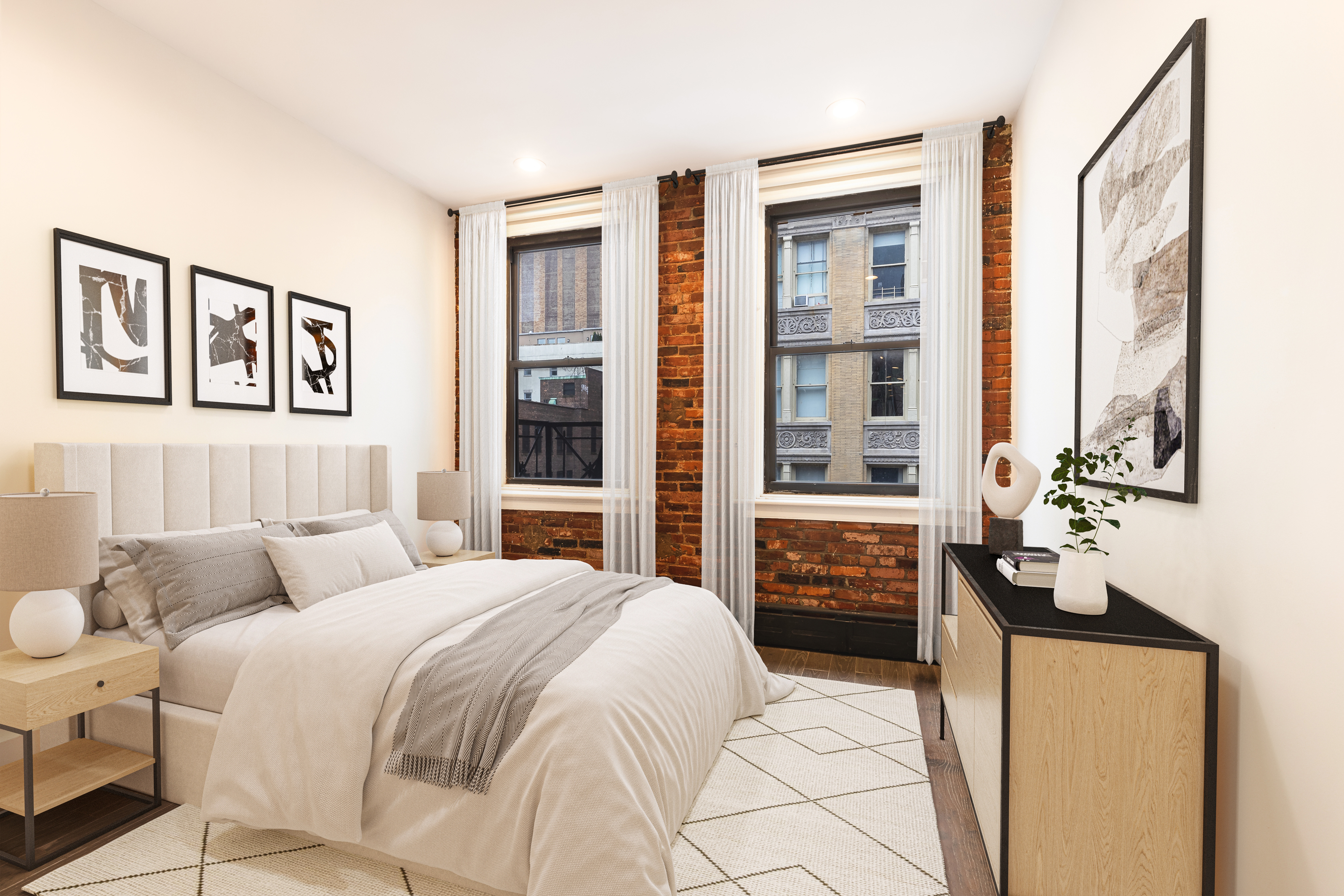 61 Lispenard Street, Unit 4 Manhattan, NY 10013 - Photo 3 of 8 a bedroom with a large bed and a window