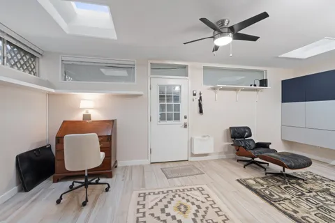 a room with furniture and wooden floor