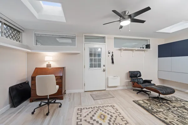 a room with furniture and wooden floor