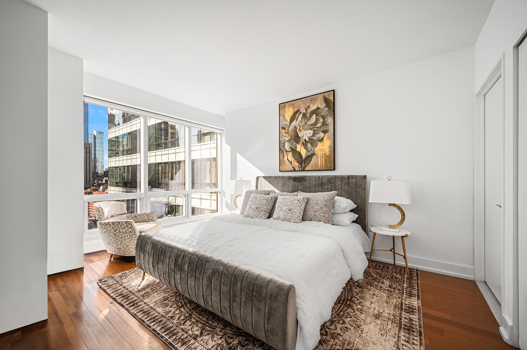 350 West 42nd Street, Unit 20G Manhattan, NY 10036 - Photo 3 of 27 a bed room with a bed and a window