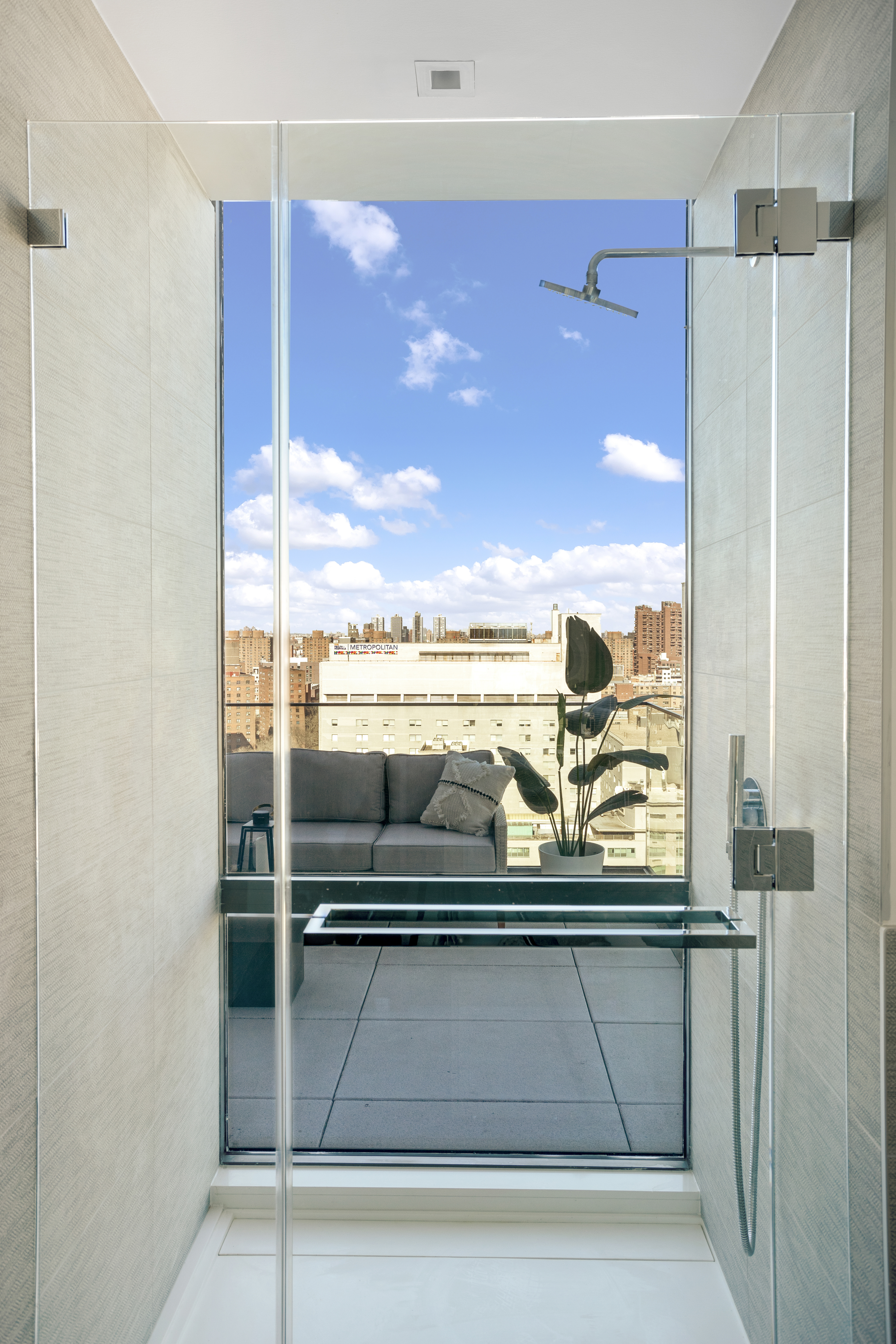 302 East 96th Street, Unit PH6 Manhattan, NY 10128 - Photo 10 of 13 a view of a glass door with a balcony