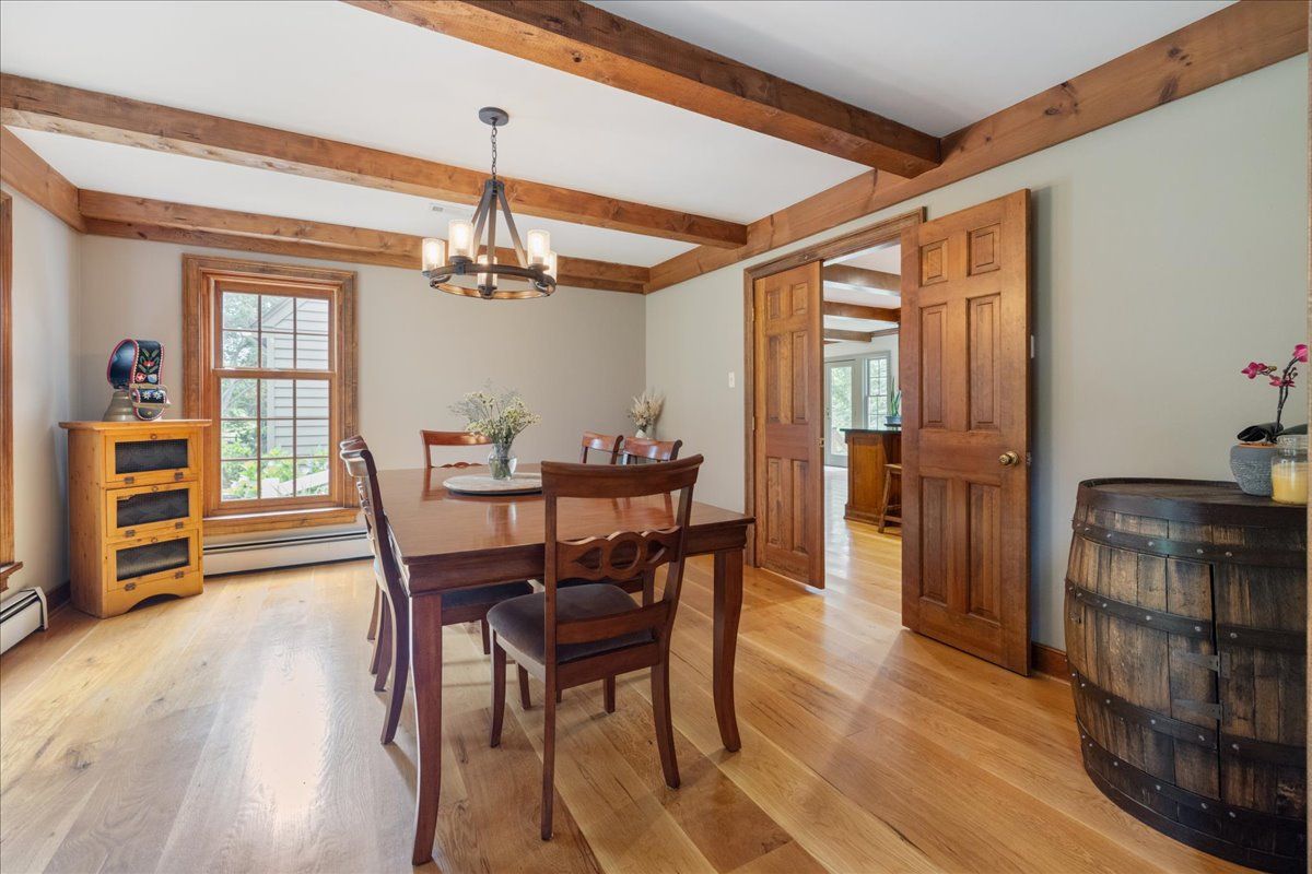 a spacious bedroom with a large bed and a large window