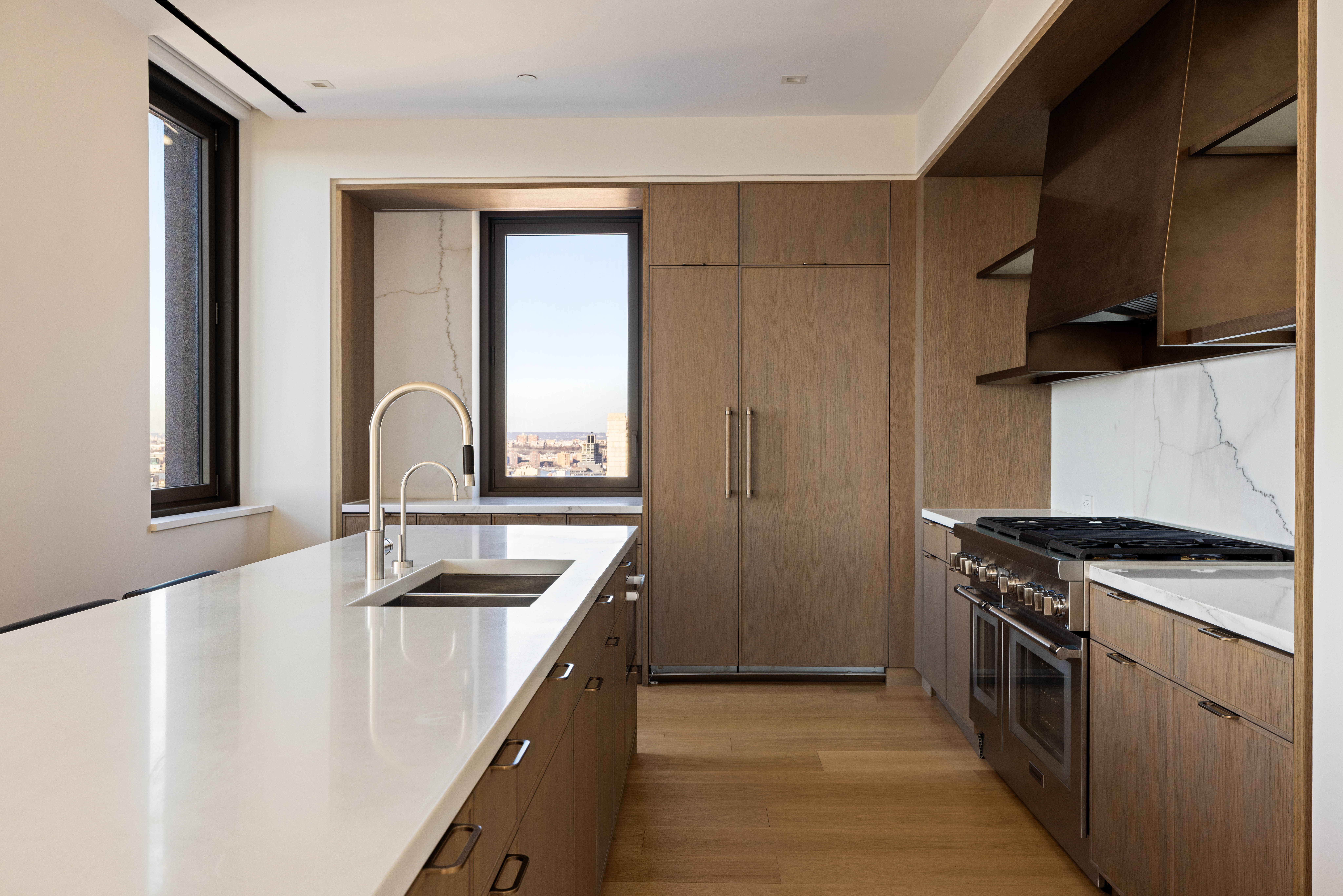 39 West 23rd Street, Unit PH Manhattan, NY 10010 - Photo 7 of 20 a kitchen that has a sink and a stove