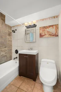 a bathroom with a sink toilet and bathtub