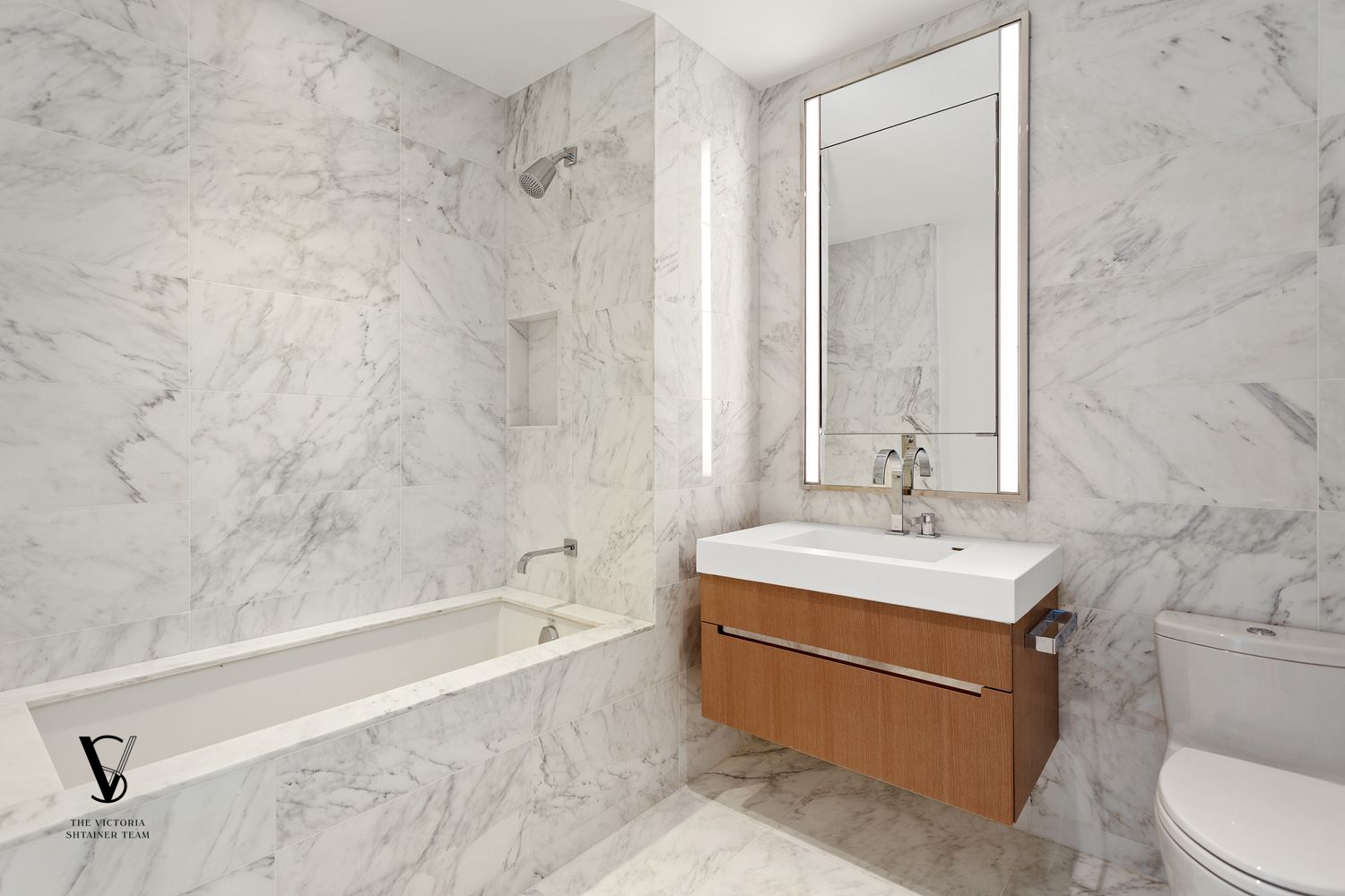 1 West End Avenue, Unit 28C Manhattan, NY 10023 - Photo 9 of 26 a spacious bathroom with a bathtub shower sink vanity and toilet