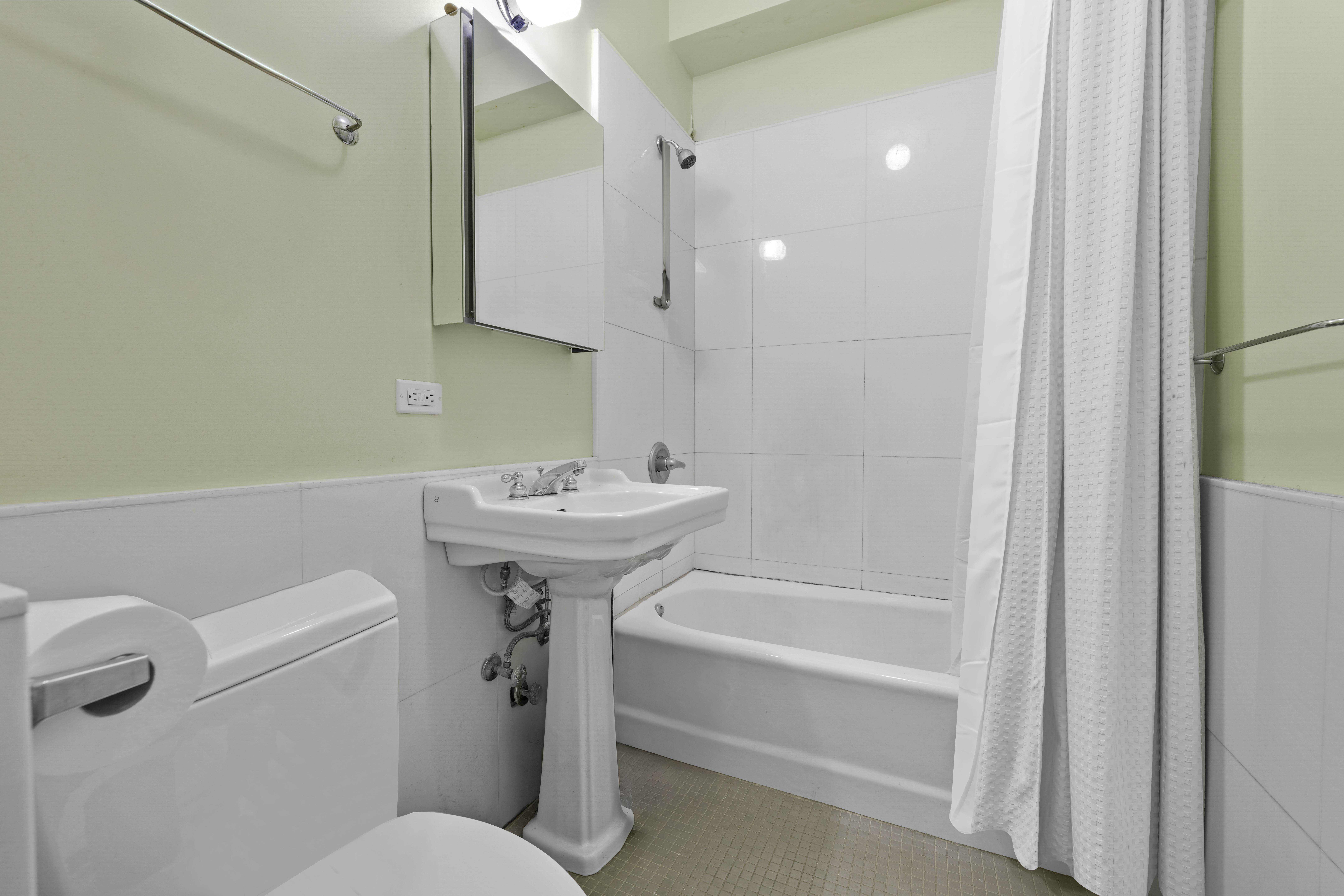 133 West 123rd Street Manhattan, NY 10027 - Photo 24 of 31 a bathroom with a sink toilet and shower