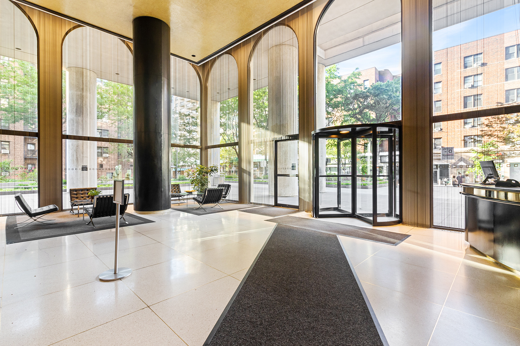 60 East 8th Street, Unit 15P Manhattan, NY 10003 - Photo 11 of 17 a view of an entryway with wooden floor and windows