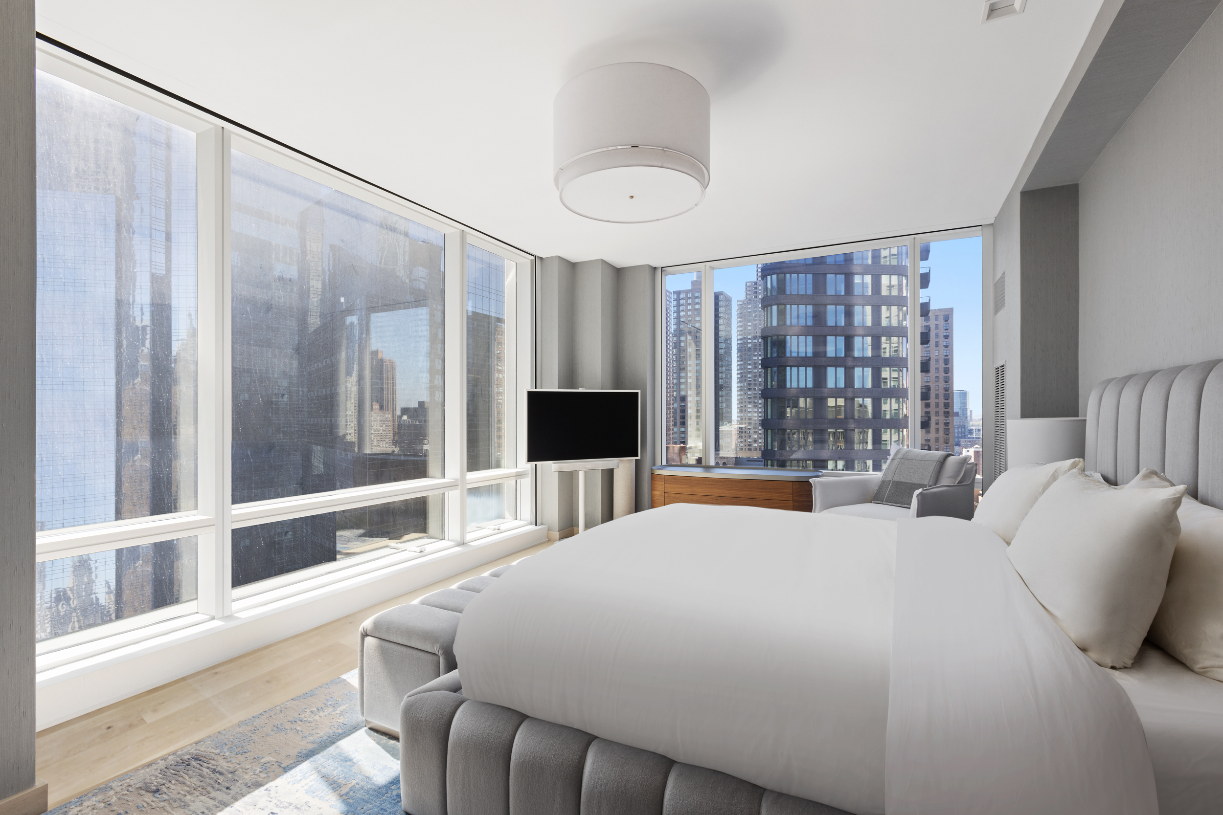 1 Central Park West, Unit 24D Manhattan, NY 10023 - Photo 12 of 19 a bedroom with a large bed and a large window